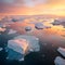 Icebergs in Greenland in the soft sunset light, top view