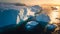 Icebergs in Greenland in the soft sunset light, top view