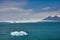 Icebergs and ice calved off the glacier slowly flow out to the ocean from the lagoon