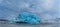 Icebergs swimming on frozen water, close-up.