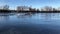 Icebreaker boat floating on the river covered with broken ice