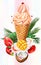 Icecream in waffle cones with mango and coconut