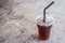 Iced americano black coffee on wooden desk