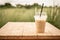 Iced blended frappucino in plastic cup on wood table. Iced coffee