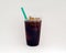 Iced coffee or Cold Brew coffee with a green straw on a white background.