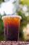 Iced Coffee espresso caffeinated beverage is placed on counter at customer orders because caffeine containing beverage is