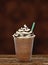 Iced coffee or frappuccino with chocolate sauce andcream