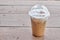 Iced coffee on wooden table in cafe house