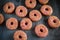 Iced doughnut rings with rainbow sparkl strands.