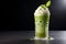 Iced Matcha Latte with Milk in Latte Glass on Black Background