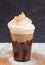 Iced Mocha in a Disposable Plastic Cup with Whipped Cream