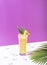 Iced pineapple punch cocktail in glass on color background. summer drink