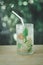 Iced plum juice mixed with lemon and soda on wooden table