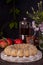 Iced sugar cake with apples on tray, tea, flowers