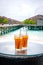 Iced tea against tropical Overwater Bungalow Resort, Maldives.