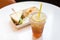 Iced tea and lemon with sandwiches