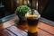Iced yuzu orange juice infused with espresso coffee decorating with sliced orange piece in plastic cup