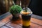 Iced yuzu orange juice infused with espresso coffee decorating with sliced orange piece in plastic cup
