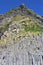 Iceland - Basalt columns on the beach at Reynisfjara with a blue sky