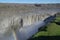 Iceland cascade of Dettifoss with a small rainbow