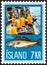 ICELAND - CIRCA 1971: A stamp printed in Iceland shows landing catch and Atlantic Cod Gadus morhua, circa 1971.