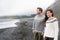 Iceland couple wearing Icelandic sweaters on beach