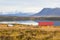 Iceland farm near the lake with mountain view