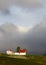 Iceland. Farmhouses near Isafjordur with dramatic sky.