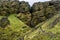 Iceland hiker tourist sightseeing visiting Raudfeldsgja Canyon gorge rift nature landscape on the Snaefellsnes peninsula
