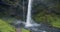 Iceland, Kvernufoss watterfall hitting stony rocks in secluded ravine Beauty of nature concept background