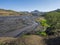 ICELAND, LANDMANNALAUGAR, August 2, 2019: man hiker after fording a river at Thorsmork on Laugavegur hiking trail with