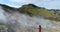Iceland nature drone video of tourist near volcano geothermal volcanic activity