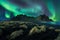 Iceland night landscape amazing northern light in vestrahorn mountain with black sand dunes at stokksnes in southern iceland