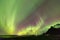 Iceland Northern Lights over Vestrahorn Mountain at Stokksnes peninsula in Southeast Iceland near Hofn