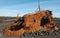 Iceland. Reykjanes Peninsula. Rusted vessel and volcanic ground.