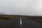 Iceland road leading straight to the horizon.