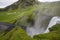 Iceland`s endless cliffs, steep and dangerous, green meets water