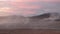 Iceland. Smoke above the earth. Global warming and climate change. Steam from the fumarole. Dramatic sky. Volcano