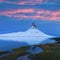 Iceland snaefellsnes peninsula and famous Kirkjufell. Kirkjufell is a beautifully shaped and a symmetric, free standing mountain.