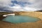 Iceland. Stora-Viti crater with water. Slope with snow.