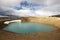 Iceland. Stora-Viti crater with water. Slope with snow.