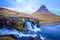 Iceland timelapse photography of waterfall and famous mountain. Kirkjufellsfoss and Kirkjufell in northern Iceland nature