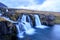 Iceland timelapse photography of waterfall and famous mountain. Kirkjufellsfoss and Kirkjufell in northern Iceland nature