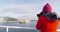 Iceland tourist photographer on harbour cruise and whale watching in Reykjavik