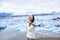 Iceland travel tourist enjoying nature landscape Jokulsarlon glacial lagoon on Iceland. Portrait of Woman standing