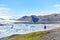 Iceland travel tourist enjoying view of nature landscape Jokulsarlon glacial lagoon / glacer lake on Iceland. Woman