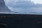 Iceland, Vestrahorn mount and black sand over the ocean