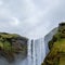 Iceland waterfall Skogafoss in Icelandic nature landscape. Famous tourist attractions and landmarks destination in Icelandic