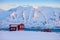 Iceland winter landscape with solitary living house positioned of the fjord at dawn near Akureyri, northern Iceland