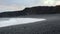 Icelandic Black Sand Beach Coast at Sunset, Volcanic Cliffside with Blue North Atlantic Ocean Water, Shot in 8K